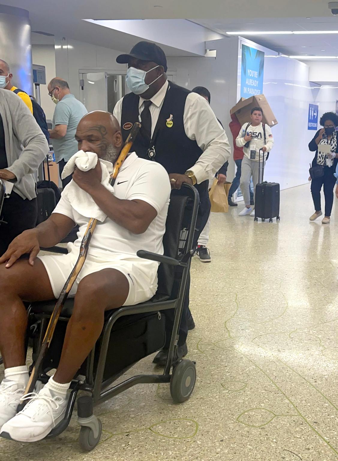 Mike Tyson spotted in wheelchair at Miami airport 1 mike tyson back pain wheelchair 01
