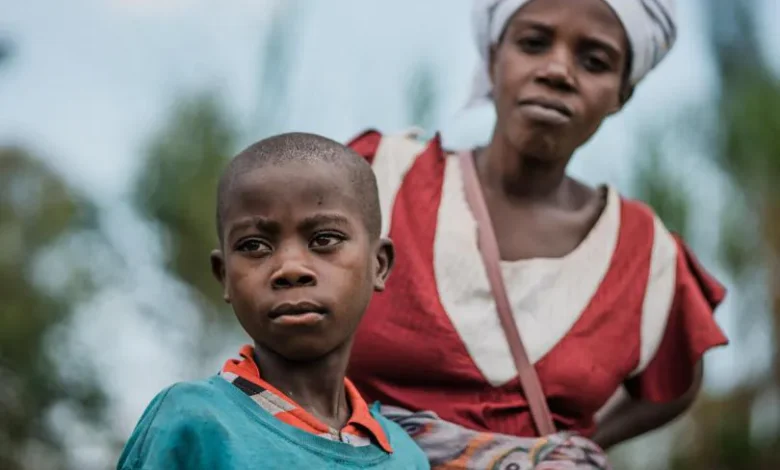 DRC remains epicentre of child suffering in war as country tops world list of grave violations against children 1 CH1807799 Mona 40 and her son Elias 12