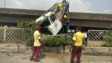BREAKING: Two injured as articulated truck falls off Apapa bridge 2 FB IMG 1704631492506