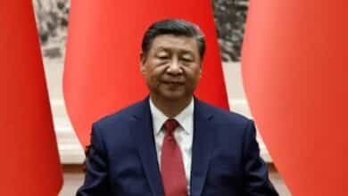 Xi tackles slow growth as economy 'hits the brakes' 14 Xi Jinpi