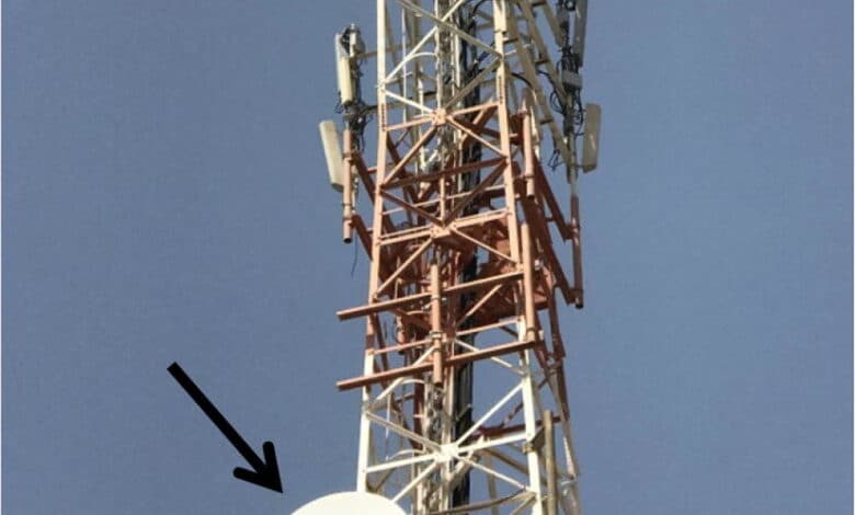 Communication mast The drum like microwave antennas indicated by the arrow are located