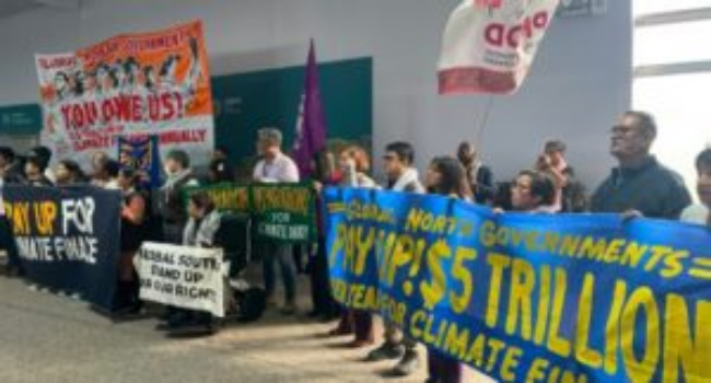 Climate Change: EU raises $300bn to help developing nations 5 Activists with banners and flags hold a gathering to demand that rich countries help developing nati1